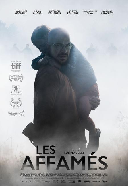 Affiche du film Les affamés de Robin Aubert (Christal Films) - On y voit Marc-andré Grondin tenir un petit garçon dans ses bras